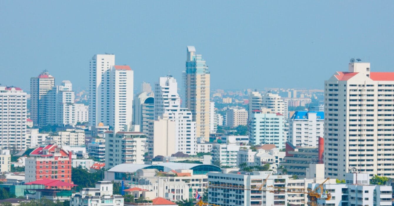 Real Estate Trends Philippines: A dense urban skyline with various high-rise buildings under a clear sky.