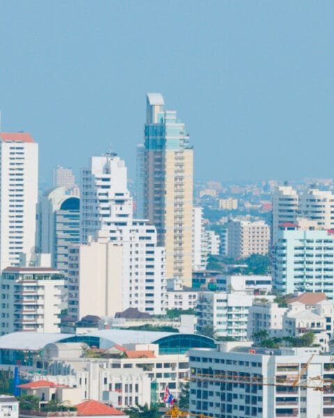 Real Estate Trends Philippines: A dense urban skyline with various high-rise buildings under a clear sky.