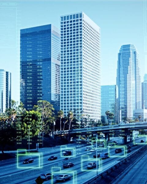 Philippines Smart City Projects: Cityscape with traffic and overlaid futuristic digital interface elements.