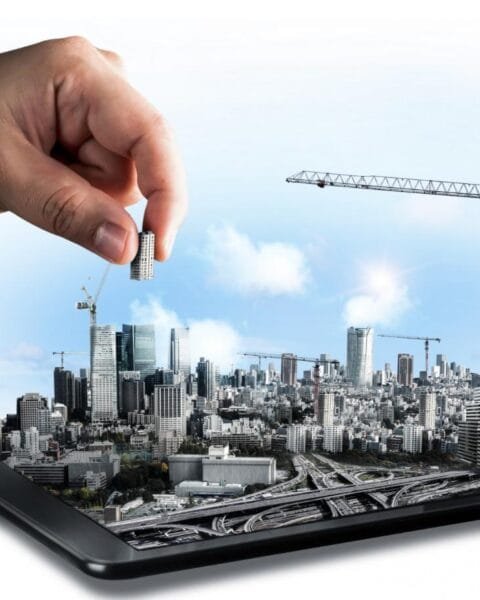 Philippines Infrastructure Development Analysis: A hand placing a miniature building into a 3D cityscape emerging from a tablet, symbolizing urban development and technology.