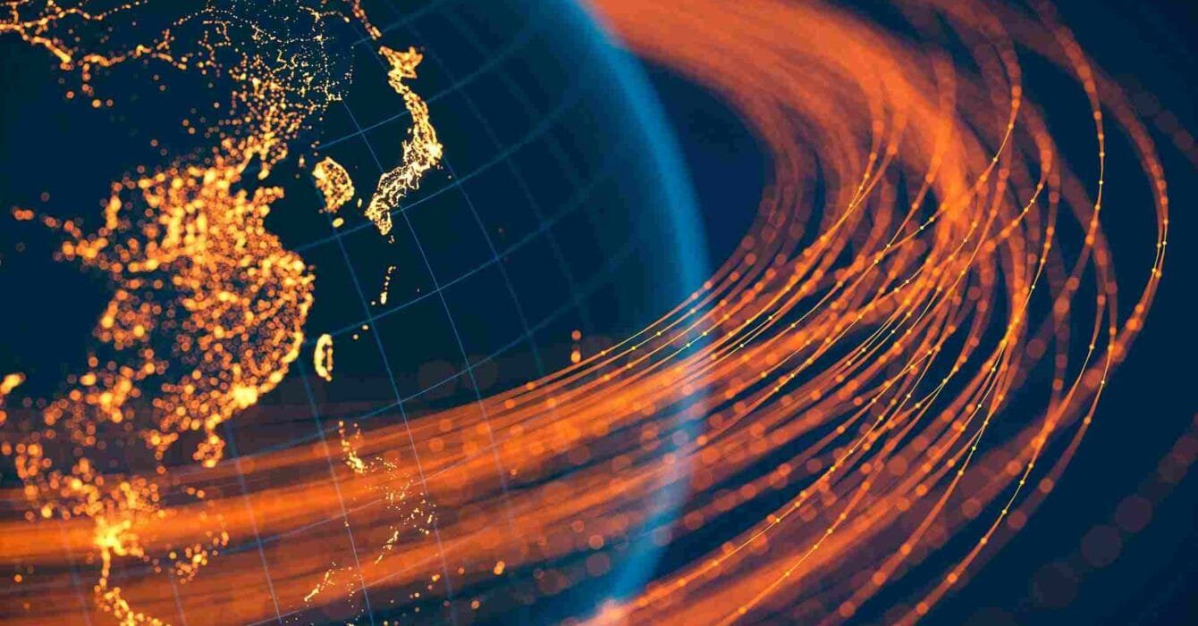 Philippines Off‑Island 5G Expansion: Adigital globe showcasing Asia, twinkling city lights, and dynamic orange data lines representing connectivity and flow.