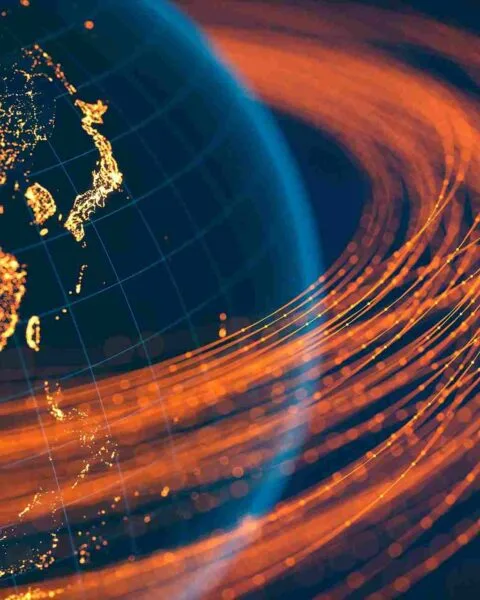 Philippines Off‑Island 5G Expansion: Adigital globe showcasing Asia, twinkling city lights, and dynamic orange data lines representing connectivity and flow.